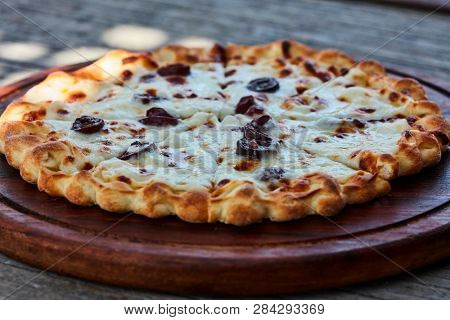 Flatbread with cheese and olives