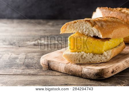 Bocadillo De Tortilla Española. Spanish Potato Omelette Sandwich On Wooden Table. Copyspace