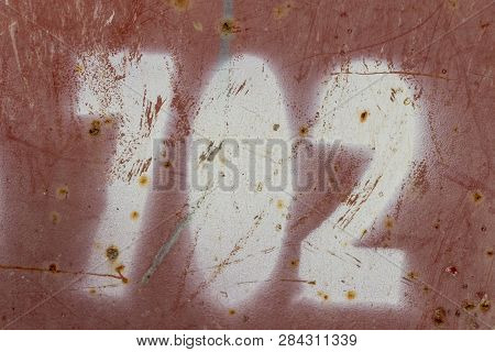 Number Seven Hundred Two Painted On Rusty Red Metal, Number 702