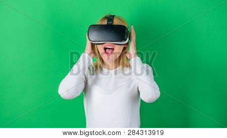 The Woman With Glasses Of Virtual Reality. Woman With Virtual Reality Headset. Happy Woman Exploring