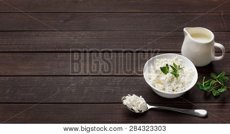 Bowl Of Cottage Cheese And Jar Of Milk On Wooden Background, Copy Space. Lacto Vegetarian Diet Conce