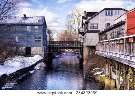 Old Buildings Lining The Williams River Running Through The Village Of West Stockbridge Massachusett