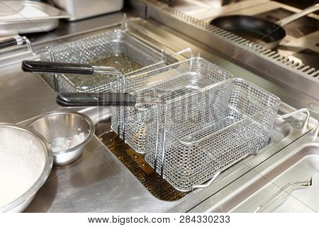 Friture cooker in restaurant kitchen, fast food venue