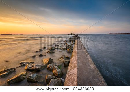 Breakwater, Entrance To The Port Of Gdansk, Górki Zachodnie, During Sunset. Baltic Sea, Poland