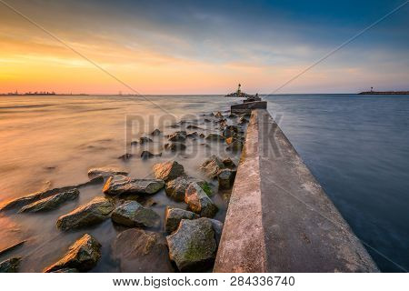 Breakwater, Entrance To The Port Of Gdansk, Górki Zachodnie, During Sunset. Baltic Sea, Poland