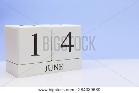 June 14st. Day 14 Of Month, Daily Calendar On White Table With Reflection, With Light Blue Backgroun