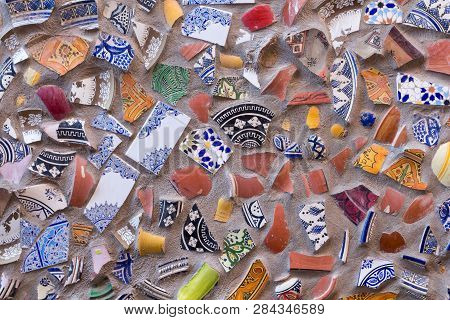 Colorful Shards Of Ornamental Floral Traditional Ceramic, Reused After Breaking For A Wall Outdoors.
