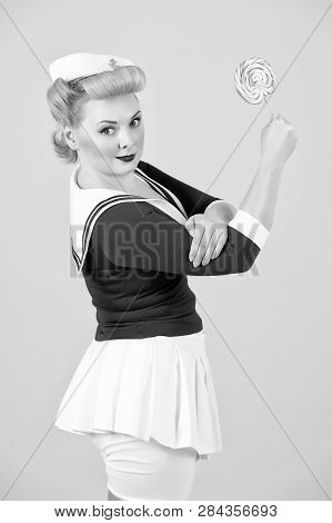 We Can Do It! Styled Girl With Candy. Anime Blonde Girl With Lollipop In Fist Up.  Sea Dressed-woman