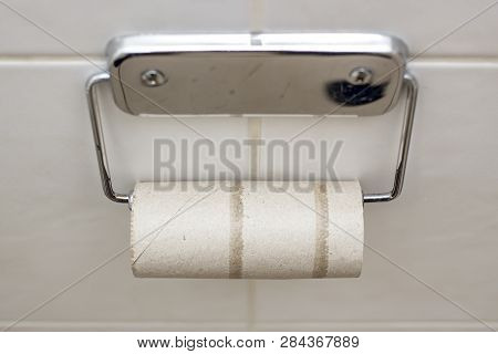 Toilet Paper In The Bathroom Ended At The Most Inopportune Moment. Awkward Situation. Close-up.