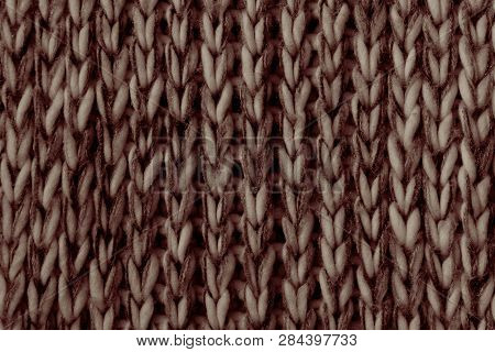 Beige Brown Knitted Fabric Texture Background. Closeup