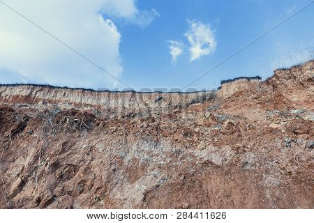 Rockslide. Mountain Landslide In An Environmentally Hazardous Area. Large Cracks In Earth, Descent O