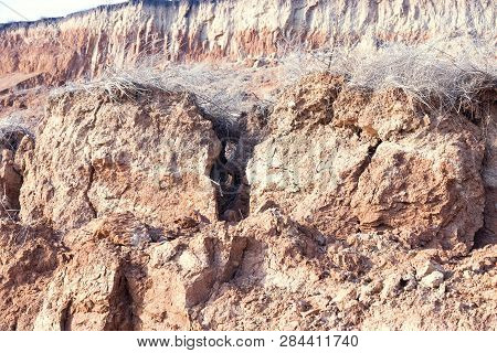 Rockslide. Mountain Landslide In An Environmentally Hazardous Area. Large Cracks In Earth, Descent O