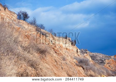 Rockslide. Mountain Landslide In An Environmentally Hazardous Area. Large Cracks In Earth, Descent O