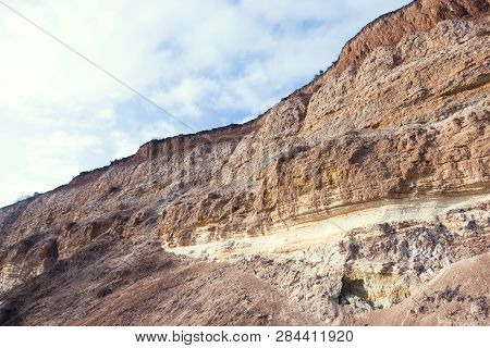 Rockslide. Mountain Landslide In An Environmentally Hazardous Area. Large Cracks In Earth, Descent O