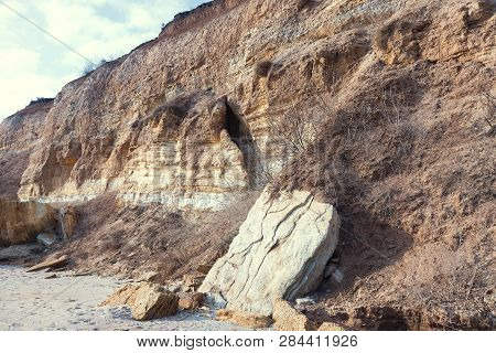 Rockslide. Mountain Landslide In An Environmentally Hazardous Area. Large Cracks In Earth, Descent O