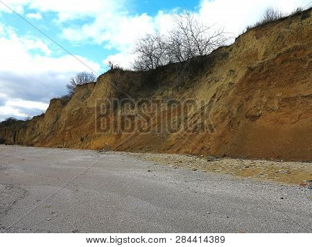 Rockslide. Mountain Landslide In An Environmentally Hazardous Area. Large Cracks In Earth, Descent O
