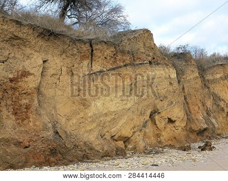 Rockslide. Mountain Landslide In An Environmentally Hazardous Area. Large Cracks In Earth, Descent O
