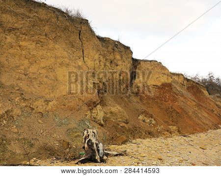 Rockslide. Mountain Landslide In An Environmentally Hazardous Area. Large Cracks In Earth, Descent O