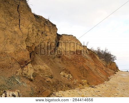 Rockslide. Mountain Landslide In An Environmentally Hazardous Area. Large Cracks In Earth, Descent O