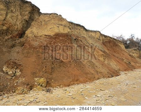 Rockslide. Mountain Landslide In An Environmentally Hazardous Area. Large Cracks In Earth, Descent O