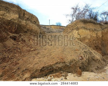 Rockslide. Mountain Landslide In An Environmentally Hazardous Area. Large Cracks In Earth, Descent O