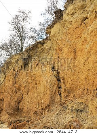 Rockslide. Mountain Landslide In An Environmentally Hazardous Area. Large Cracks In Earth, Descent O