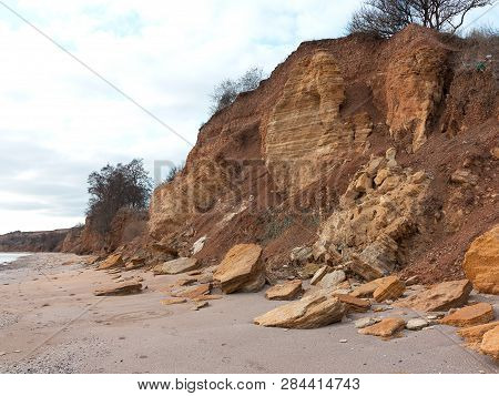 Rockslide. Mountain Landslide In An Environmentally Hazardous Area. Large Cracks In Earth, Descent O