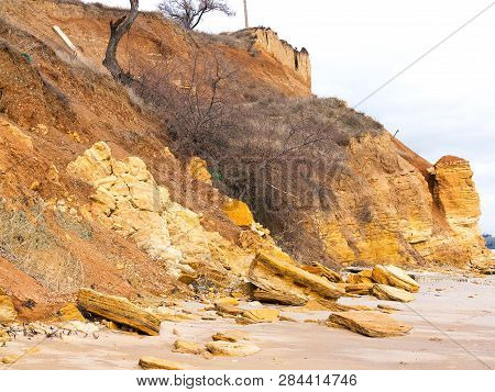 Rockslide. Mountain Landslide In An Environmentally Hazardous Area. Large Cracks In Earth, Descent O
