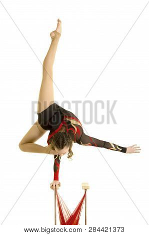 Flexible Equilibrist Performs Exercises On Acrobatic Walking Sticks.