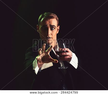 Wait. Mime Artist Perform On Stage. Stage Actor Pantomime Drinking Wine. Comedian With Mime Makeup H