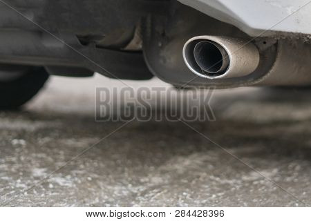 Close Up Exaust Pipe Of A Car Releasing Gas