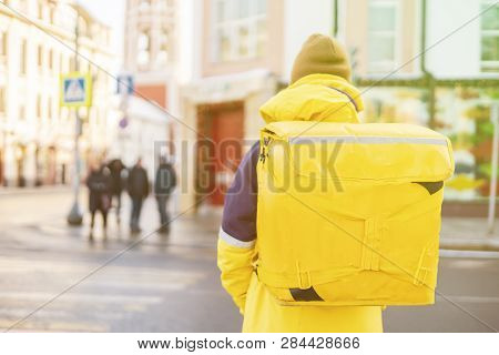 Courier Delievery Guy With Huge Backpack On Foot
