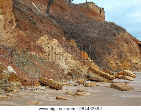 Rockslide. Mountain Landslide In An Environmentally Hazardous Area. Large Cracks In Earth, Descent O