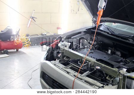 Macro View Of Modern Automobile In Autoservice With Opened Car Engine Details. Mechanic Car Repair S