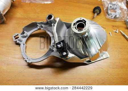 Macro View Of Repairing, Installation And Tuning Headlight Of Modern Automobile And Car Projector Le