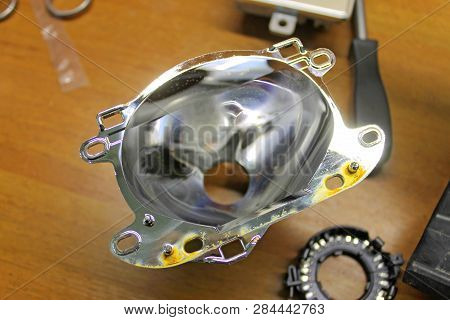 Macro View Of Repairing, Installation And Tuning Headlight Of Modern Automobile And Car Projector Le