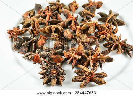 Chinese Star Anise Spice Fruit On Plate White Background - Other Names Star Aniseed , Badiane , Badi