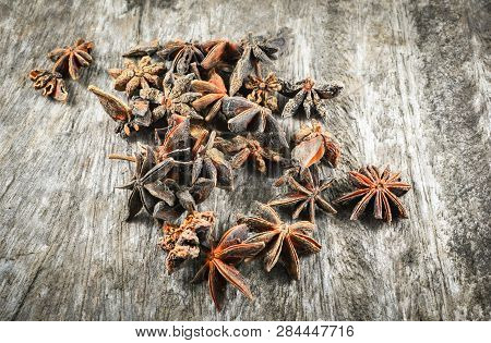 Chinese Star Anise Spice Fruit On Old Wood Background - Other Names Star Aniseed , Badiane , Badian 