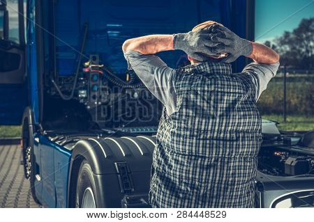 Depressed Truck Driver Having Big Problem With Broken Semi Truck Tractor. Transportation And Automot