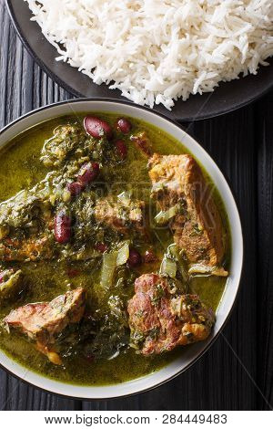 Authentic Ghormeh Sabzi Dish Of Lamb Stew Meat With Herbs And Beans Close-up In A Bowl And Rice. Ver