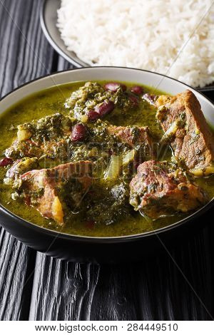 Middle Eastern Lamb Stew Meat With Herbs And Beans Close-up In A Bowl And Rice. Vertical