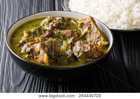 Freshly Prepared Ghormeh Sabzi Of Lamb Stew Meat With Herbs And Beans Close-up In A Bowl And Rice. H