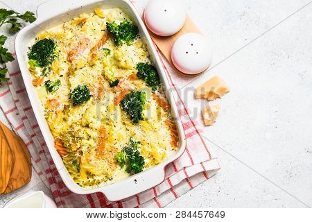 Casserole From Pasta And Vegetables - Carrot, Broccoli And Cauliflower In Cream Sauce With Parmesan.