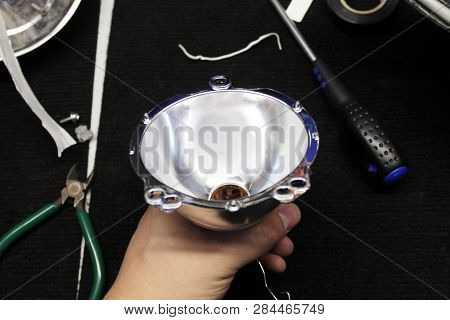 Macro View Of Repairing, Installation And Tuning Headlight Of Modern Automobile And Car Projector Le