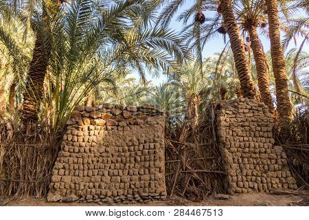 An Old Traditional Building Made Of Clay, Thatched Walls And Adobe Bricks In The Gardens Of Date Pal