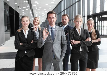 Portrait Of Successful Business People Team Standing Together In Modern Office Building