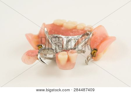 Bugel Remove Dentures With Attachments On White Background