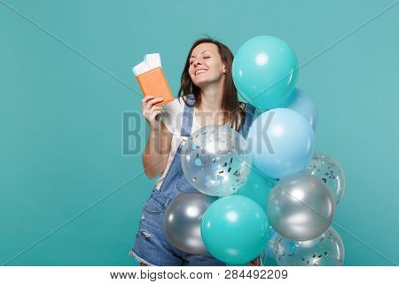 Relaxed Young Girl With Closed Eyes Holding Passport Boarding Pass Ticket Celebrating With Colorful 