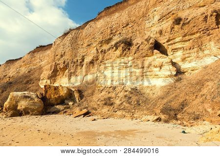 Rockslide. Mountain Landslide In An Environmentally Hazardous Area. Large Cracks In Earth, Descent O