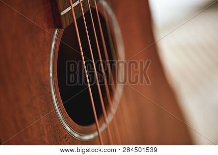Get To Know Your Instrument. Close Up Photo Of Acoustic Guitar Sound Hole.